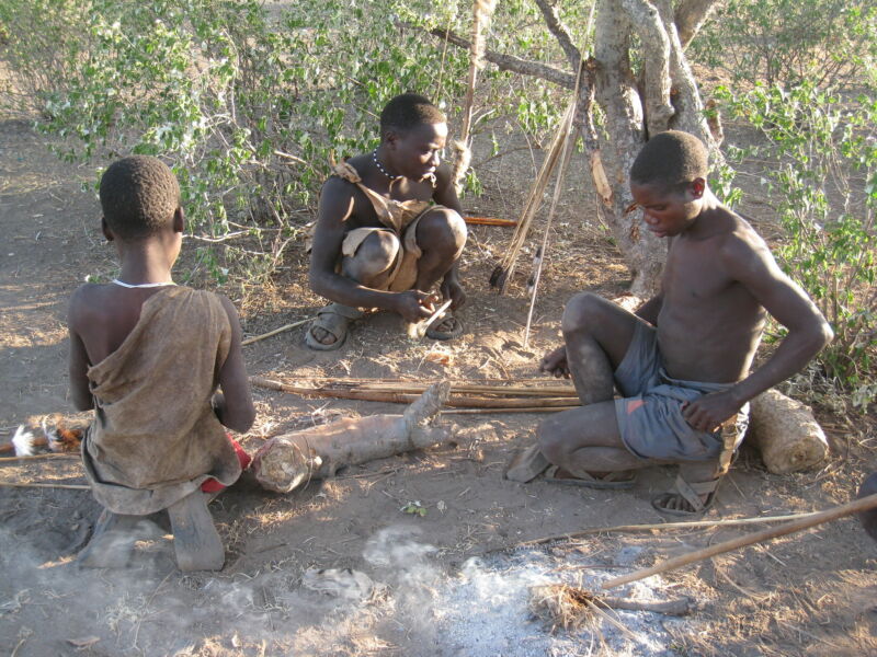 Images of three young men squatting.