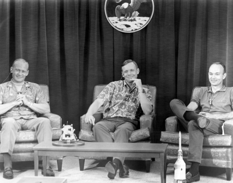 Apollo 11 crew members (L-R) Buzz Aldrin, Neil Armstrong, and Michael Collins are amused by a question posed shortly before launch.