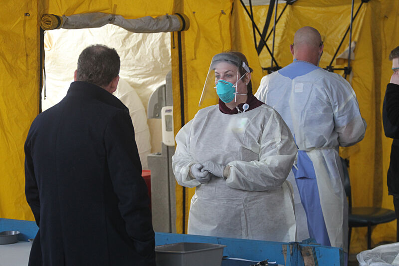 NEWTON, MA - MARCH 17: Medical professionals work in coronavirus testing tents at Newton Wellesley Hospital in Newton, MA on March 17, 2020.