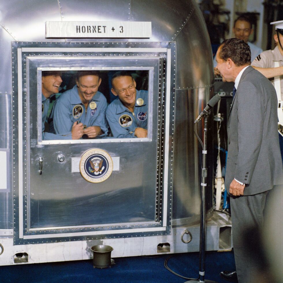 President Richard M. Nixon visits the central Pacific recovery area to welcome the Apollo 11 astronauts aboard the USS <em>Hornet</em>, prime recovery ship for Apollo 11. Aldrin is at right.