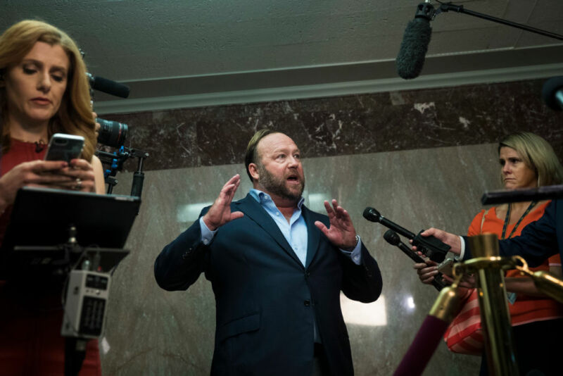 Alex Jones of InfoWars talks to reporters outside a Senate Intelligence Committee hearing concerning foreign influence operations' use of social media platforms, on Capitol Hill, September 5, 2018 in Washington, DC
