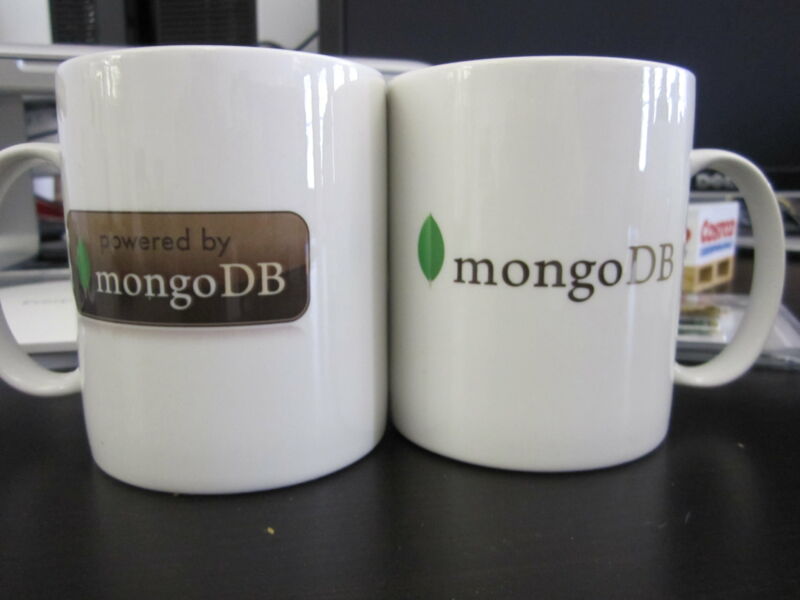 Coffee mugs with MongoDB logos on them.