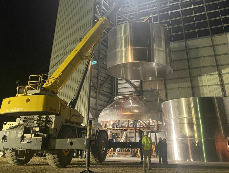 Three barrels welded together are lowered onto a pressure dome for SN2 at the South Texas Launch Site this week.