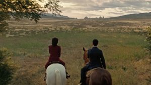 Screengrab of Maeve and Lee on horses