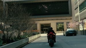 Screengrab of Dolores on a motorcycle
