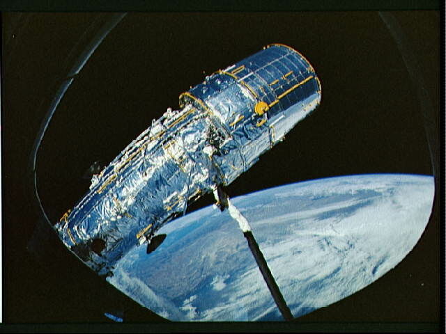 Deployment of the Hubble Space Telescope solar array panel during STS-31. 