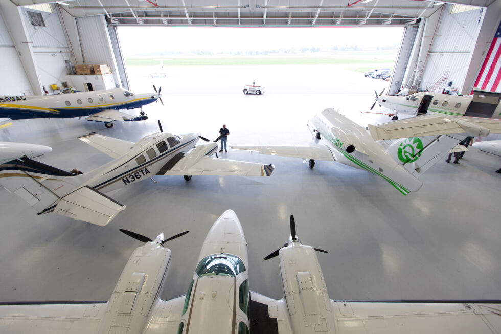  All three airplane types currently flown by Quest Diagnostics awaiting a night's work in the hangar. PC-12s sit forward at left and right by the door. Beech Barons are in the foreground at left and center. An Embraer Phenom 100 is in the foreground on the right.