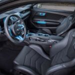The Mustang Lithium has a full interior and a six-speed manual transmission and remains street legal.