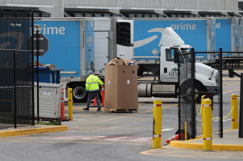 A worker hauling boxes at an Amazon warehouse in Baltimore, Maryland, on April 14. 