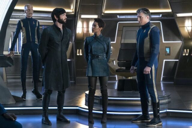 First Officer Saru (Doug Jones), Spock (Ethan Peck), Science Specialist Michael (Sonequa Martin Green), and Captain Christopher Pike (Anson Mount) on the USS <em>Discovery</em> (NCC-1031).