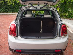 The rear of a Mini Cooper SE with the hatch open