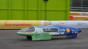 A vehicle that looks like a streamlined torpedo with three wheels