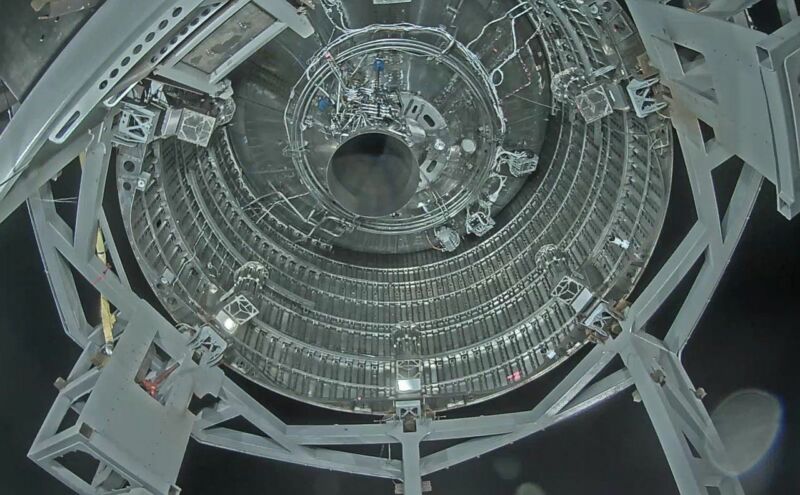 A view into the maw of SN4, showing a single Raptor engine mounted inside.