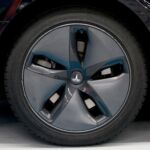 When a wheel rotates, it disturbs the air a lot, and that causes aerodynamic drag. That's why electric cars often have wheel faces that are as close to being a solid disc as possible, while still allowing the brakes to cool.
