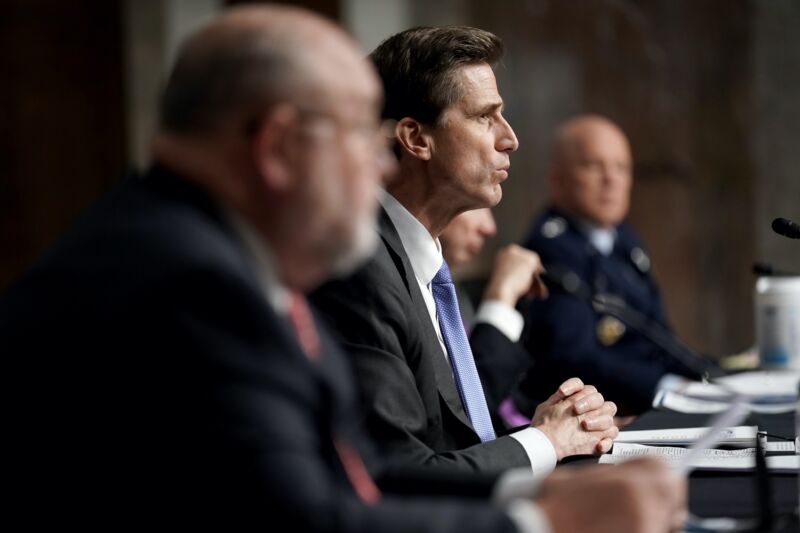 Department of Defense CIO Dana Deasy sitting at a table while testifying at a Senate hearing.