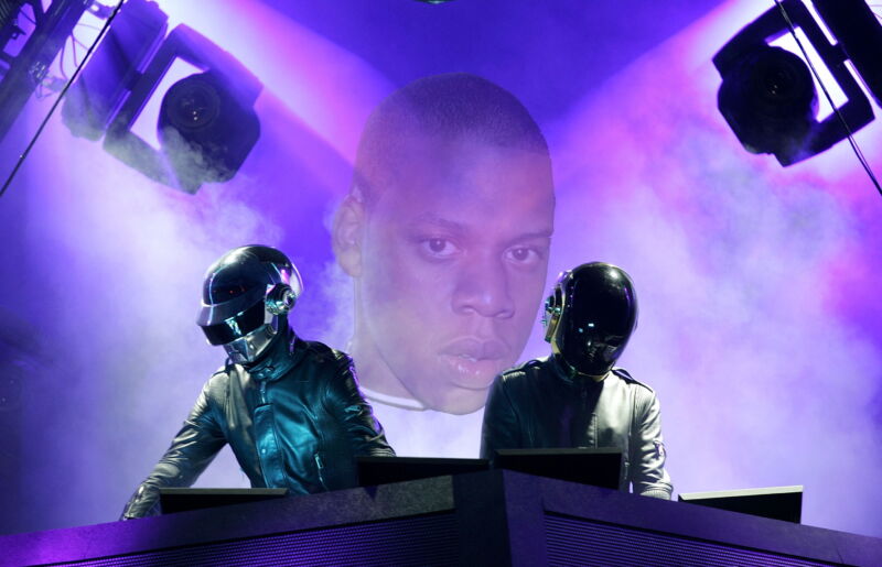 Jay-Z's visage hovers over a pair of robot DJs.