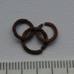 Linked rings with the appearance of copper.