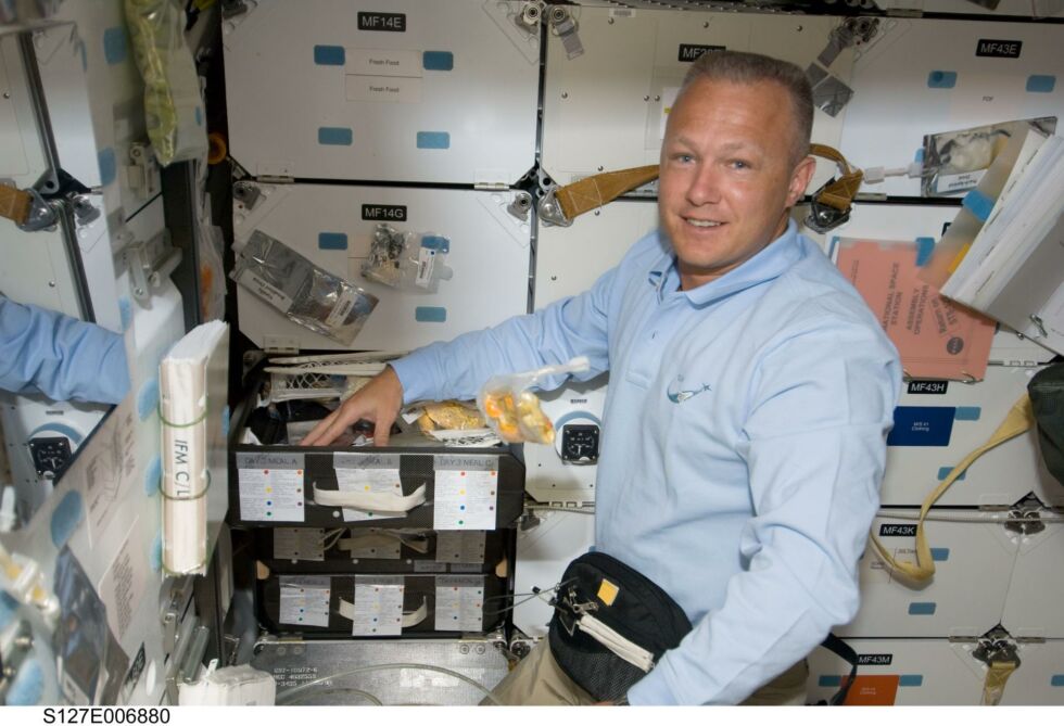 A younger Hurley on the space shuttle's mid deck on STS-127 in 2009.