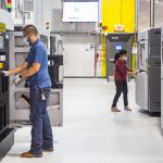 General Motors additive-manufacturing team members working at the still-under-construction Additive Innovation Center. The company uses a mix of printers from companies like Stratasys, Markforged, and HP.