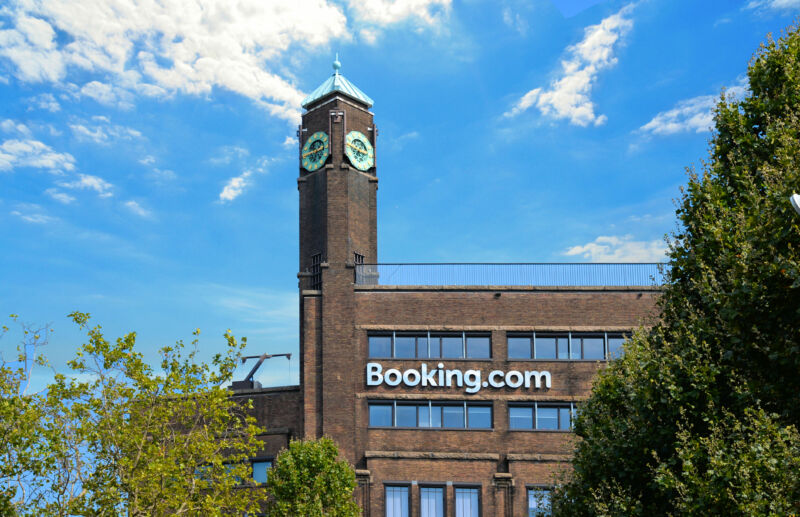 A multistory red-brick building with a clocktower.