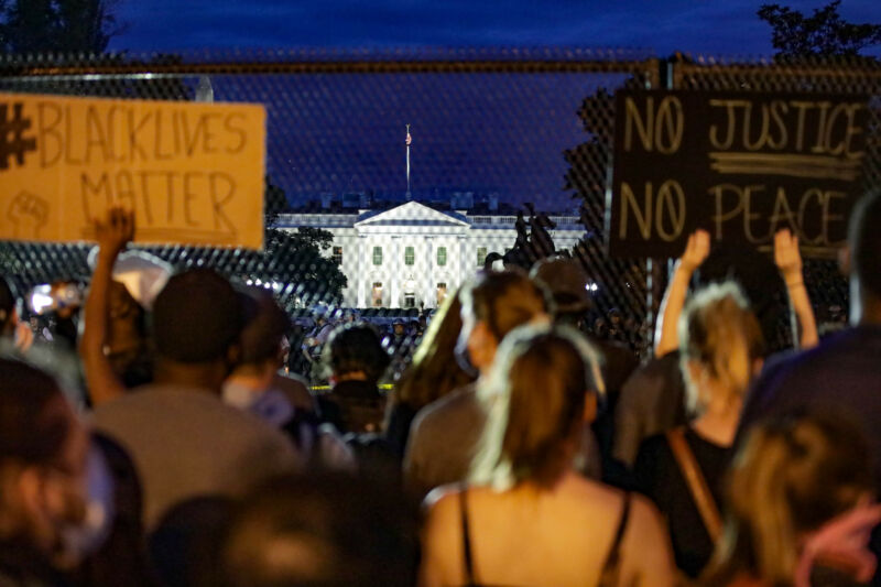 Thousands of peaceful demonstrators holding banners gather in front of the White House for the fifth consecutive day to protest the death of George Floyd, an unarmed black man who died after being pinned down by a white police officer in Minneapolis, on June 2, 2020 in Washington, DC, United States.