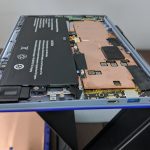 Have a dramatic side view, before we remove the battery. Spotted the missing component yet?