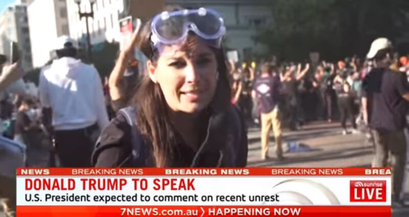 Australian reporter Amelia Brace speaks on camera shortly after the police punched her cameraman.