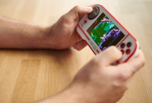 Promotional image for handheld video game device.