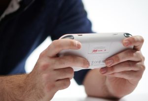 Promotional image of portable video game device.