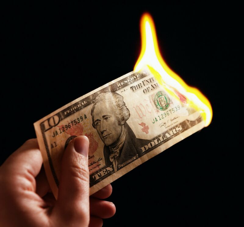 Illustration of a $10 bill on fire.