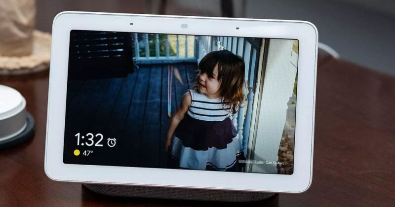 A smart home security device displays an image of a child on a porch.