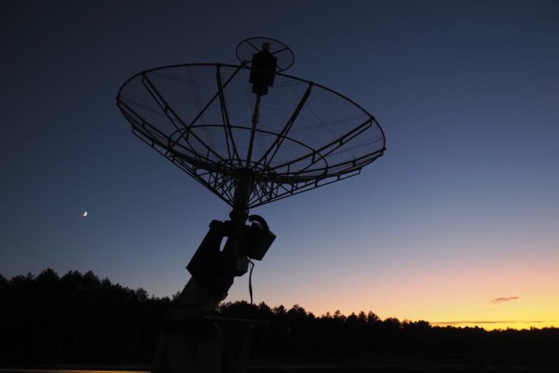 The moon is seen behind an antenna on the site of the radiotelescope of Nancay on October 03, 2019, near Vierzon, Central France.