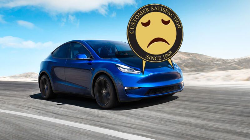 A frowny face has been photoshopped onto a Tesla speeding down a road.