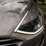 The LED daylight running lights blend into a chrome strip that continues up to the A pillar.