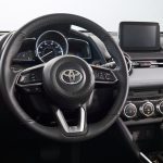 The badge on the boss says Toyota, but this wheel is Mazda's last-generation multifunction wheel.