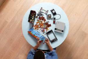 A man builds the Lego NES set