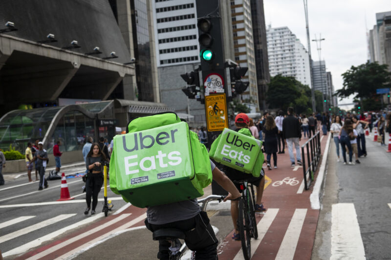 Bicycle couriers making deliveries to Uber Eats customers in São Paulo in April, 2019 (a year before the novel coronavirus pandemic). 