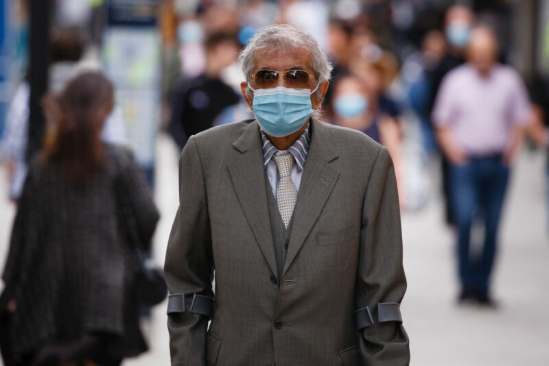 An elderly gentleman wearing a face mask.