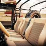 The interior is nicer than any factory Land Rover Defender.