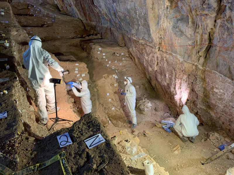 Assistant professor Mikkel Winther Pedersen with team members wore PPE to avoid contaminating potential ancient DNA in the cave; no human DNA was found.