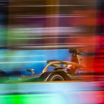 A very colorful image of a Formula E car on track in Berlin