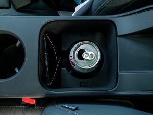 A can of Diet Coke in the second cupholder of a polestar 2