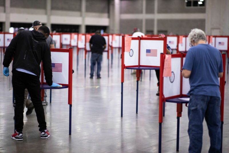 Image of widely spaced voting booths.