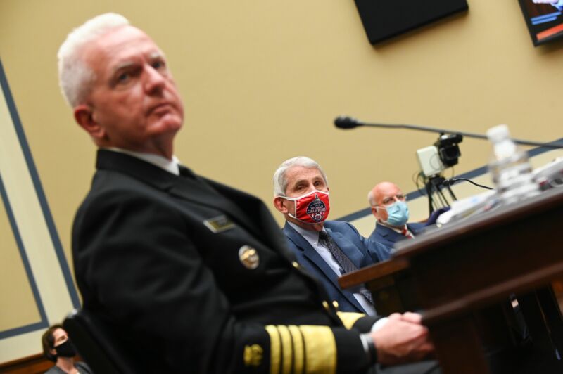 Admiral Brett Giroir, US Assistant Secretary of Health, from the left, Anthony Fauci, director of the National Institute of Allergy and Infectious Diseases, and Robert Redfield, director of the Centers for Disease Control and Prevention (CDC), listen during a House Select Subcommittee on the Hearing on the Coronavirus Crisis in Washington, DC, July 31, 2020. 