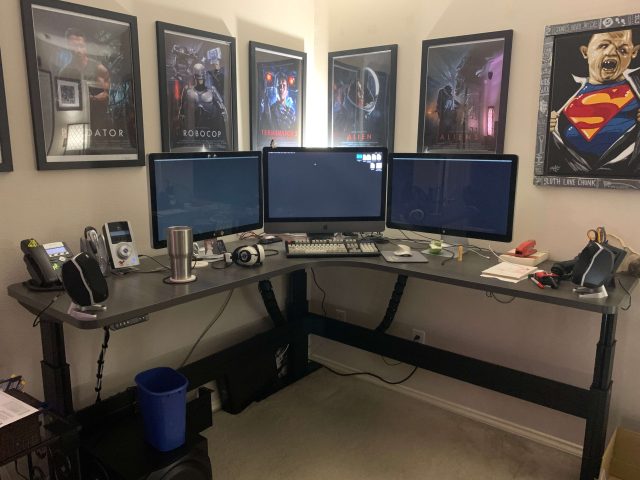 Your humble author's work-from-home setup, now with standing desk. (Though I paid for the desk and the computer and the monitors out of my own pocket, because I am an angry old IT guy and I make my own technology choices.)