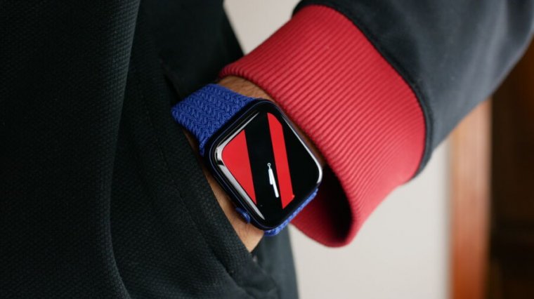 Apple Watch Series 6 On A Reviewers Wrist, Showing The Striped Watch Face