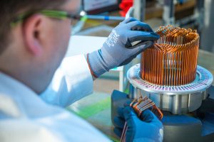 An electric motor stator is assembled by hand during pre- production at General Motors Global Propulsion Systems Center in Pontiac, Michigan
