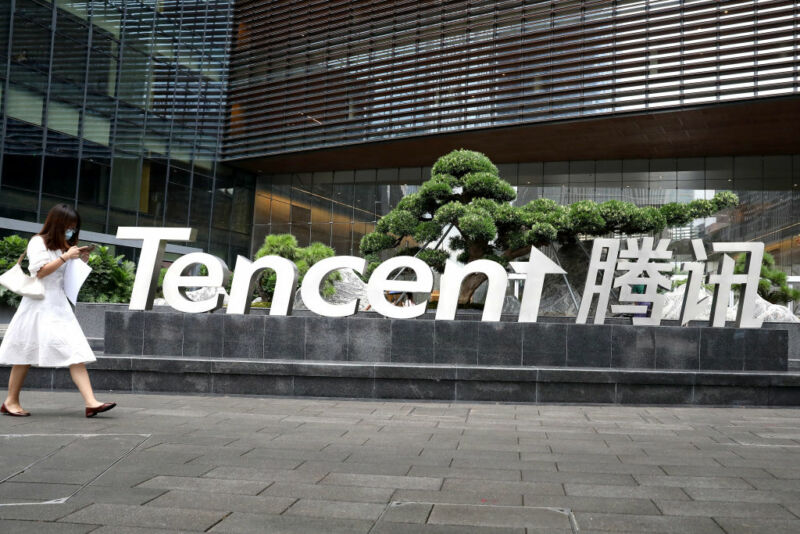 SHENZHEN, CHINA - AUGUST 19: A woman walks outside the headquarters of Tencent on August 19, 2020 in Shenzhen, Guangdong Province of China. (Photo by VCG/VCG via Getty Images)