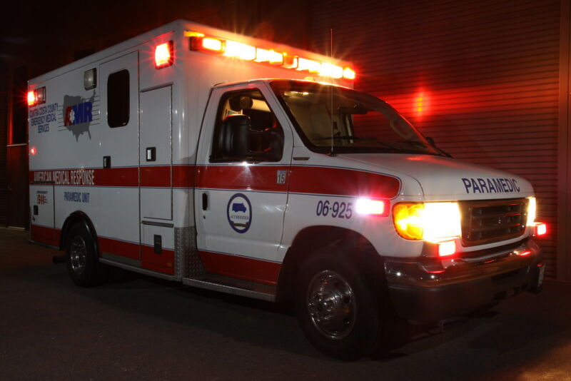 Rotating lights flash on an ambulance.