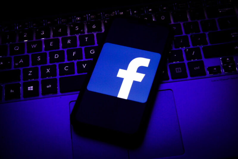 Logo Of Facebook Displayed On A Smartphone Screen And Keyboard Are Seen In This Illustration Photo Taken In Krakow, Poland On August 11, 2020. (Photo Illustration By Jakub Porzycki/Nurphoto Via Getty Images)